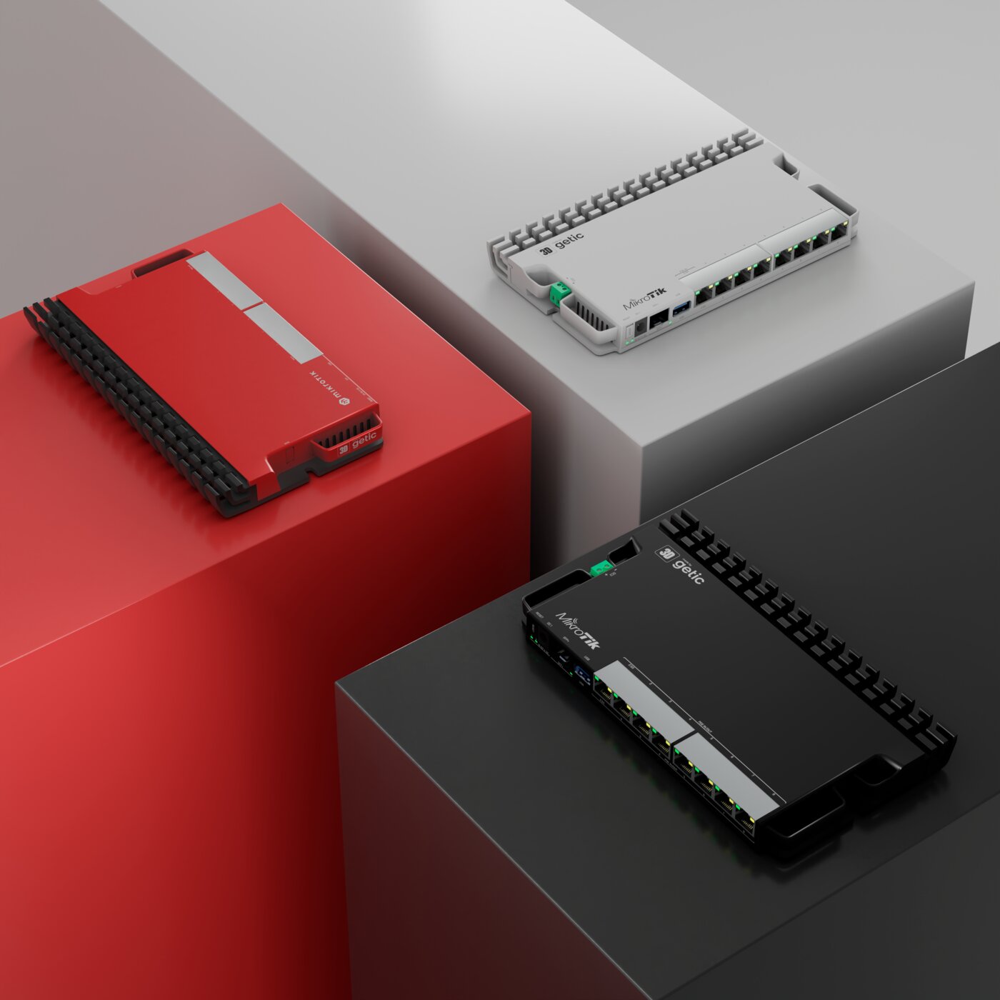 Three MikroTik switches on podiums: red, white and black